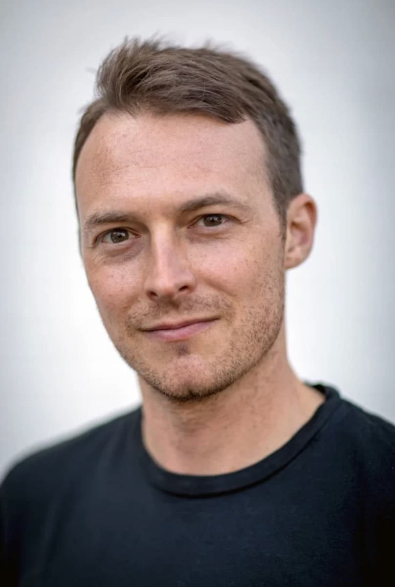 Color portrait of Josh Haner wearing a black shirt